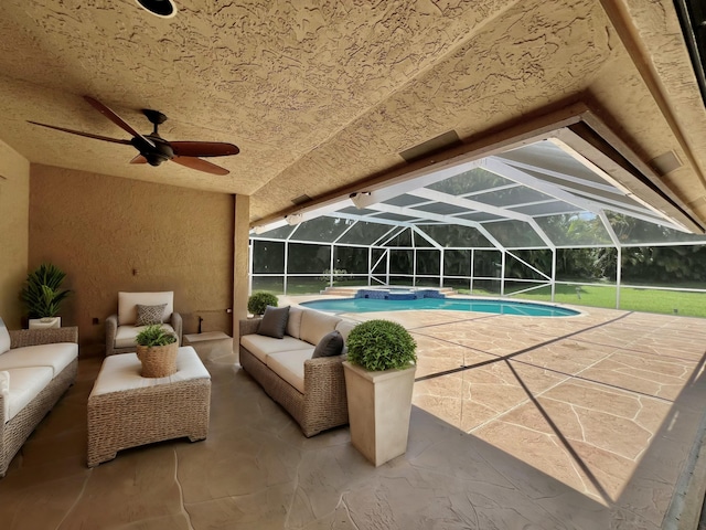 view of pool featuring outdoor lounge area, a patio, and a lanai