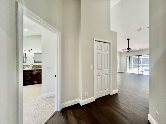 hall with sink and hardwood / wood-style floors