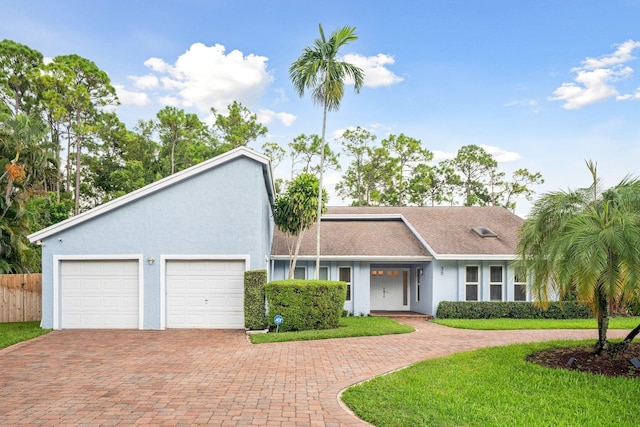 ranch-style house featuring a garage