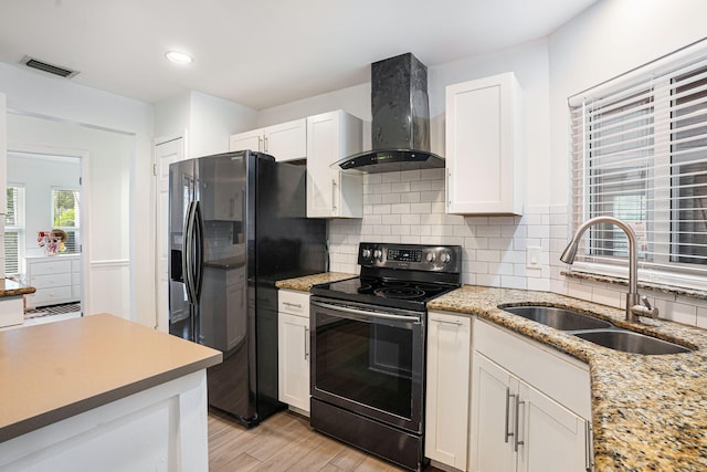 kitchen with white cabinetry, electric range, sink, wall chimney exhaust hood, and refrigerator with ice dispenser