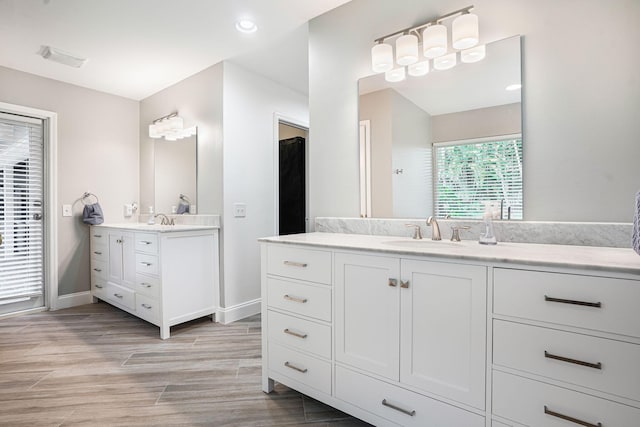 bathroom with hardwood / wood-style flooring and vanity