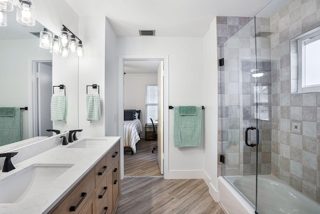 bathroom featuring vanity and bath / shower combo with glass door