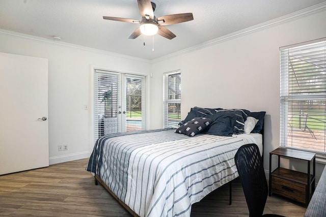 bedroom with multiple windows, wood-type flooring, ceiling fan, and ornamental molding