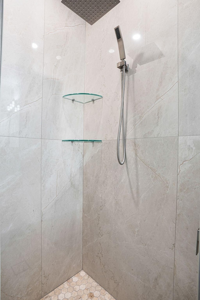 bathroom with a tile shower