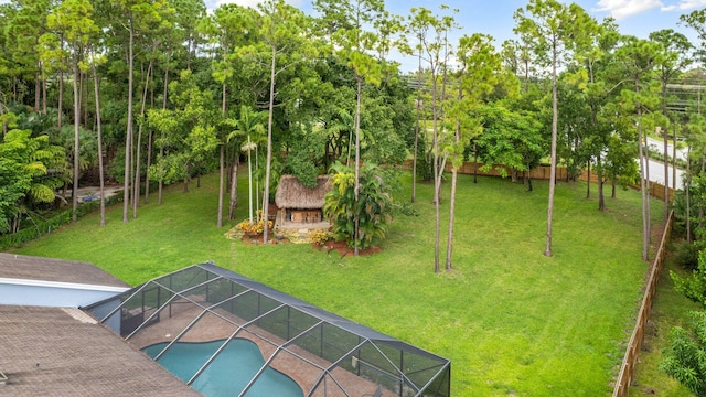 view of yard featuring glass enclosure