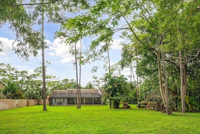 view of yard featuring a lanai