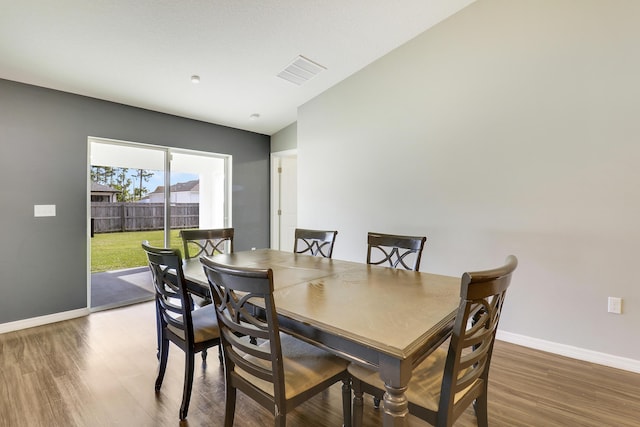 dining space featuring dark hardwood / wood-style flooring