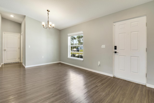 interior space with dark hardwood / wood-style flooring and an inviting chandelier