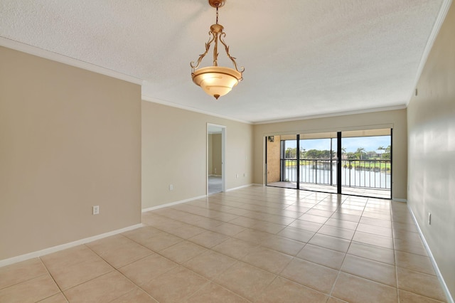 tiled empty room with a water view, crown molding, and a textured ceiling