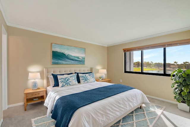 carpeted bedroom with ornamental molding