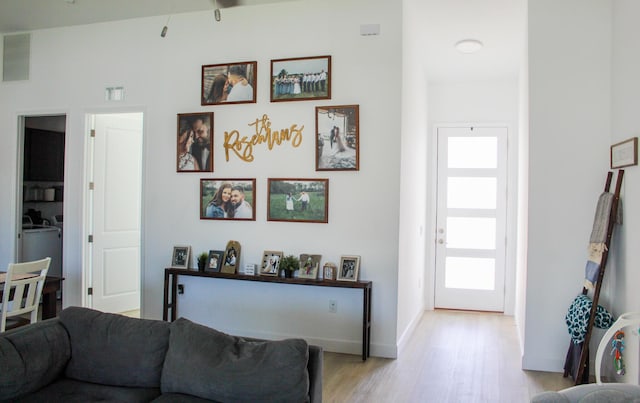 living room with light hardwood / wood-style flooring