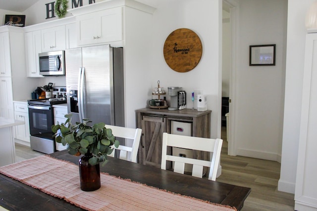 dining space featuring hardwood / wood-style floors