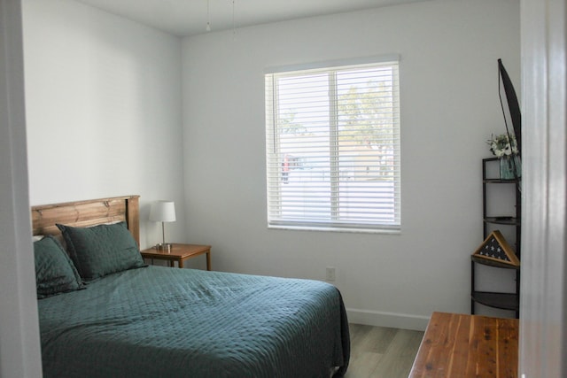 bedroom with light hardwood / wood-style flooring