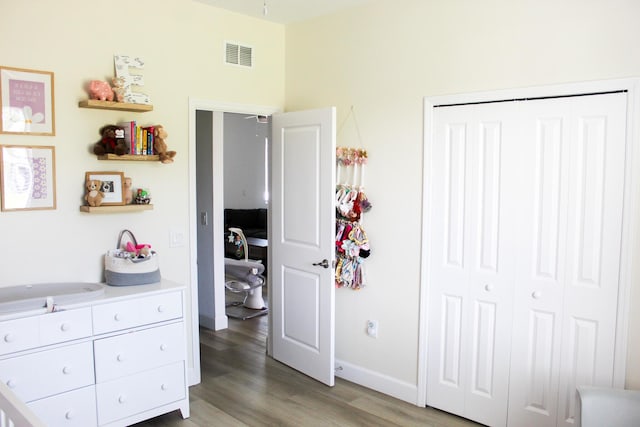 bedroom featuring a closet and dark wood-type flooring