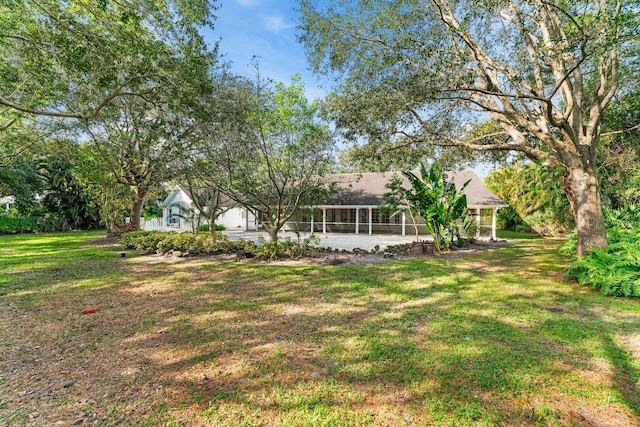 view of yard with a sunroom