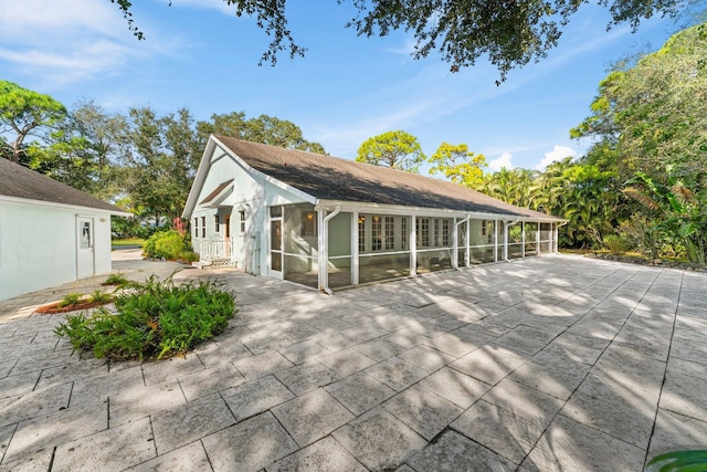 view of property exterior featuring a patio