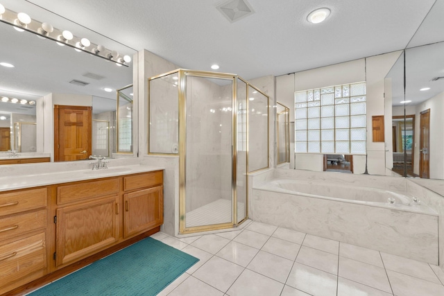 bathroom featuring tile patterned floors, vanity, and independent shower and bath