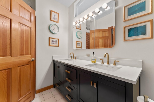 bathroom with tile patterned flooring and vanity