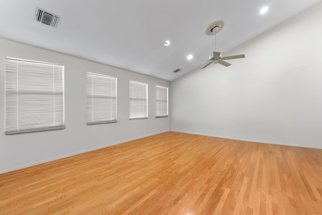 spare room featuring light hardwood / wood-style flooring, ceiling fan, and lofted ceiling