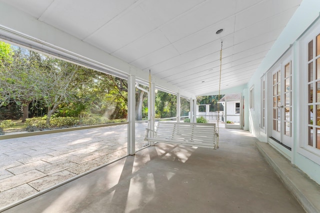 unfurnished sunroom with vaulted ceiling