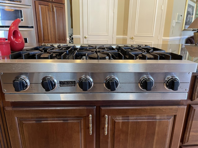 interior details featuring double oven and cooktop