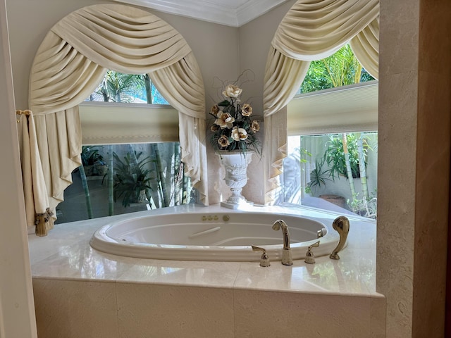 bathroom with a relaxing tiled tub, crown molding, and a wealth of natural light