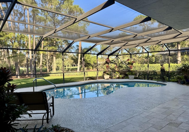 view of swimming pool featuring a patio area and glass enclosure