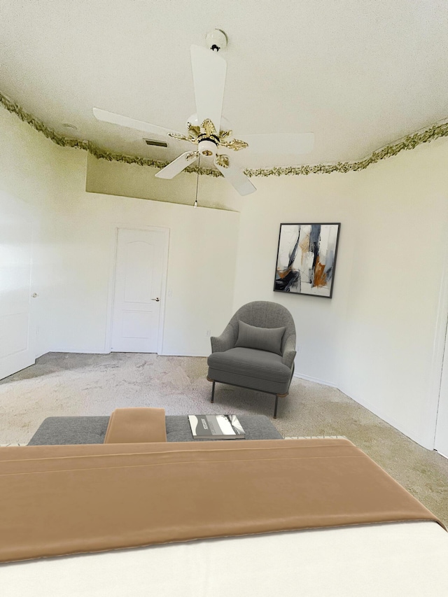 unfurnished room with carpet flooring and ceiling fan