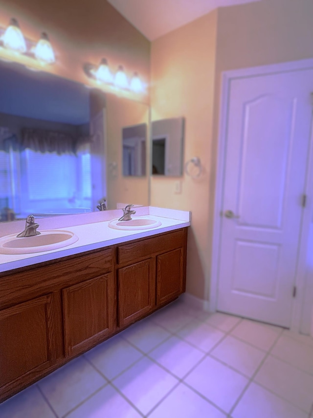 bathroom with tile patterned floors and vanity