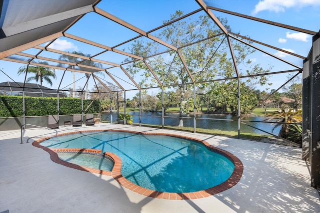 view of pool featuring a patio, an in ground hot tub, glass enclosure, and a water view