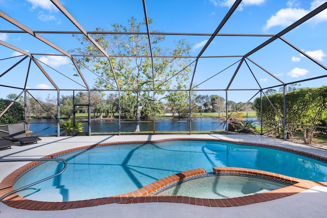 view of swimming pool featuring a lanai, a patio area, an in ground hot tub, and a water view