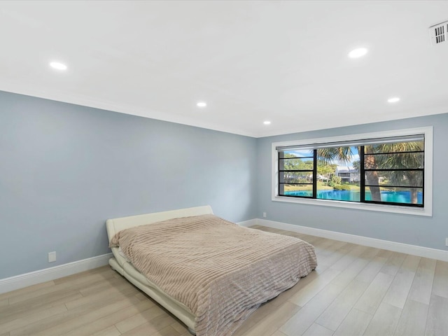 bedroom with light hardwood / wood-style floors