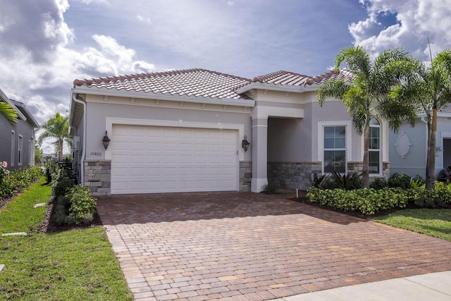 mediterranean / spanish-style house featuring a garage