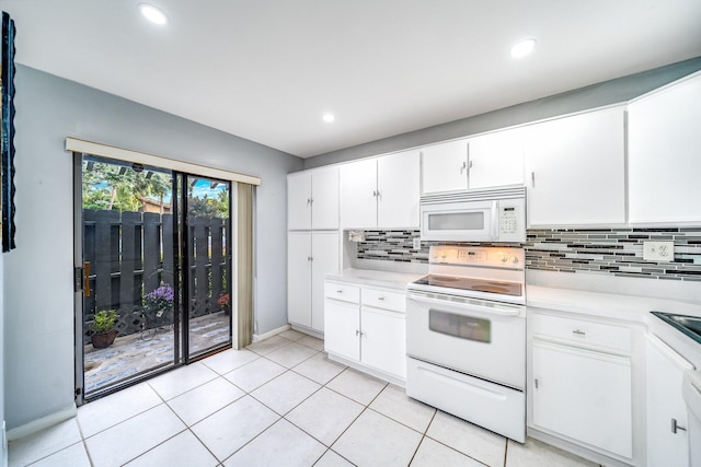 kitchen featuring backsplash, white cabinetry, light tile patterned floors, and white appliances