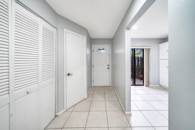 entryway with light tile patterned floors