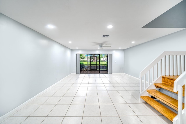 tiled living room with ceiling fan