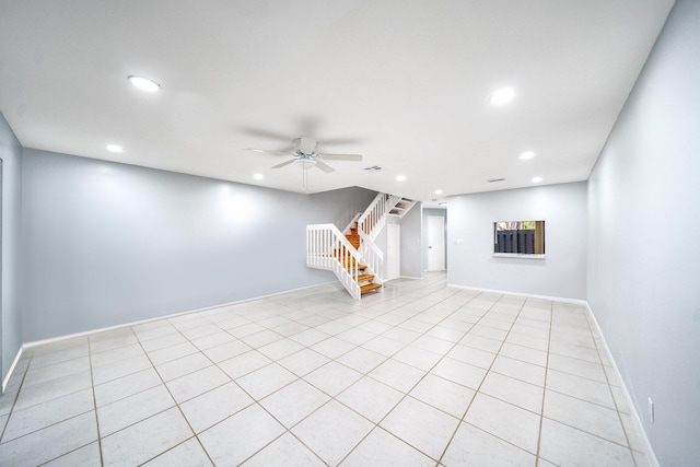 unfurnished living room featuring ceiling fan and light tile patterned flooring