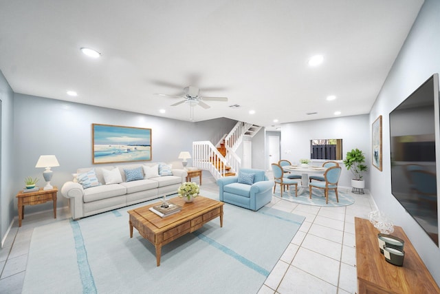 tiled living room with ceiling fan