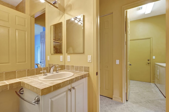 bathroom with vanity and tile patterned floors