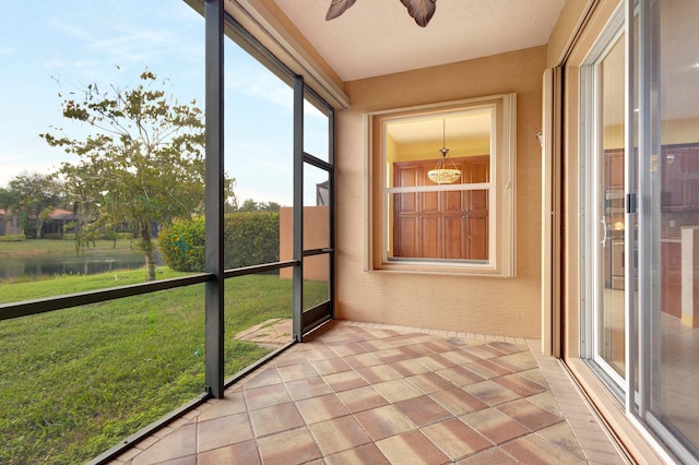 10623 Silverton Ln, Boynton Beach, FL 33437 - unfurnished sunroom featuring a water view and ceiling fan