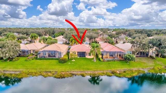 birds eye view of property with a water view