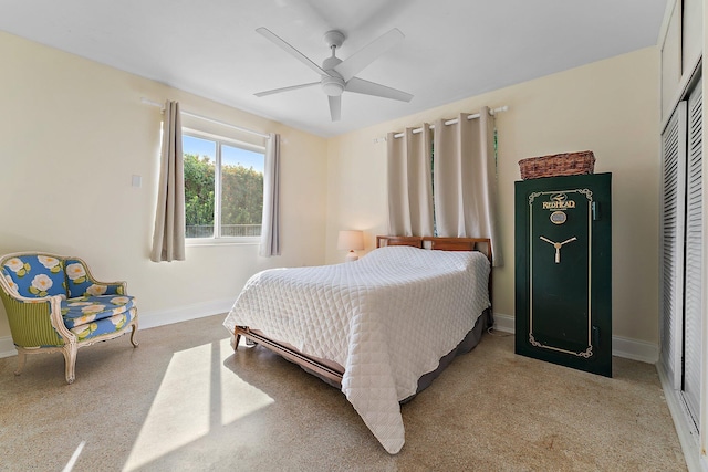 bedroom featuring ceiling fan and a closet