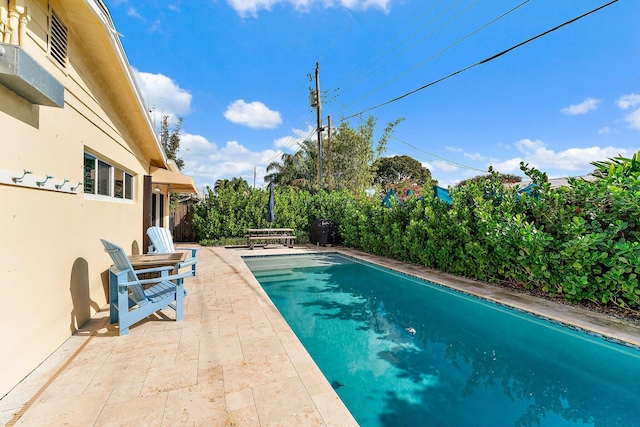 view of pool with a patio area