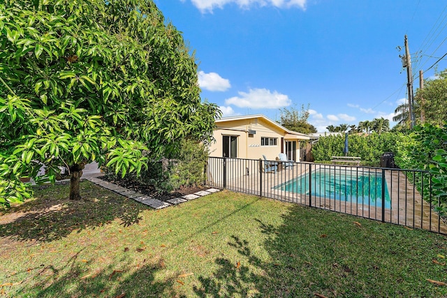 view of yard featuring a fenced in pool and a patio area