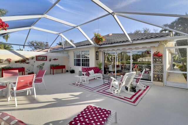 view of patio featuring a lanai