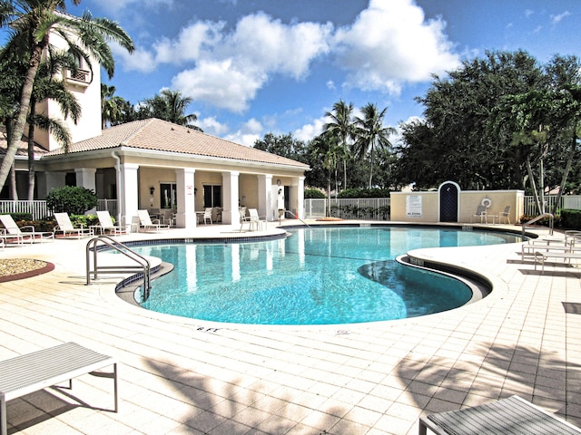 view of swimming pool featuring a patio area