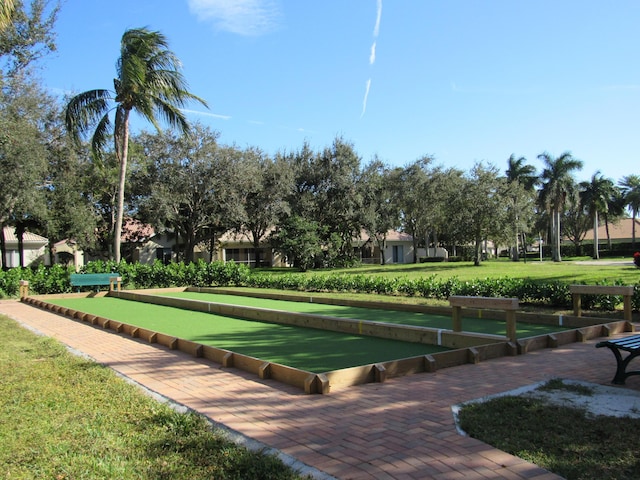 view of property's community with a yard