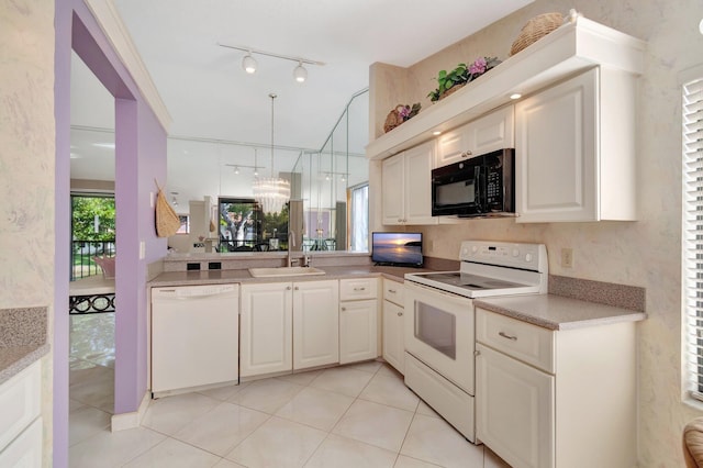 kitchen with light tile patterned flooring, white cabinetry, sink, hanging light fixtures, and white appliances