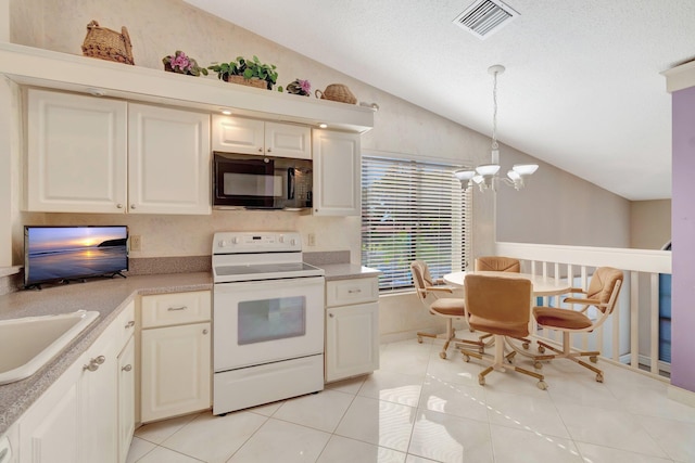 kitchen with white electric range, a chandelier, vaulted ceiling, light tile patterned floors, and pendant lighting