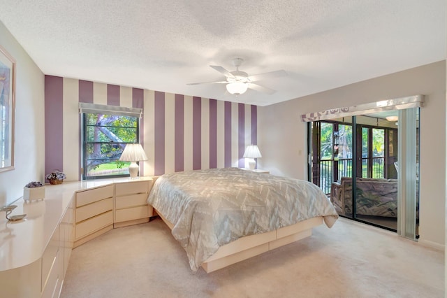 bedroom with ceiling fan, light colored carpet, multiple windows, and access to outside